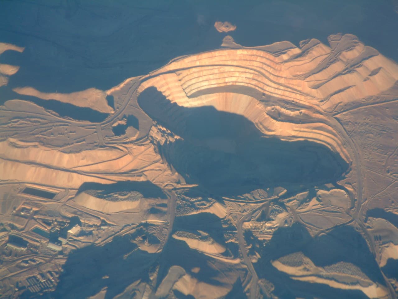 Aerial view of the terraced open pit of the Chuquicamata copper mine near Calama, Chile.