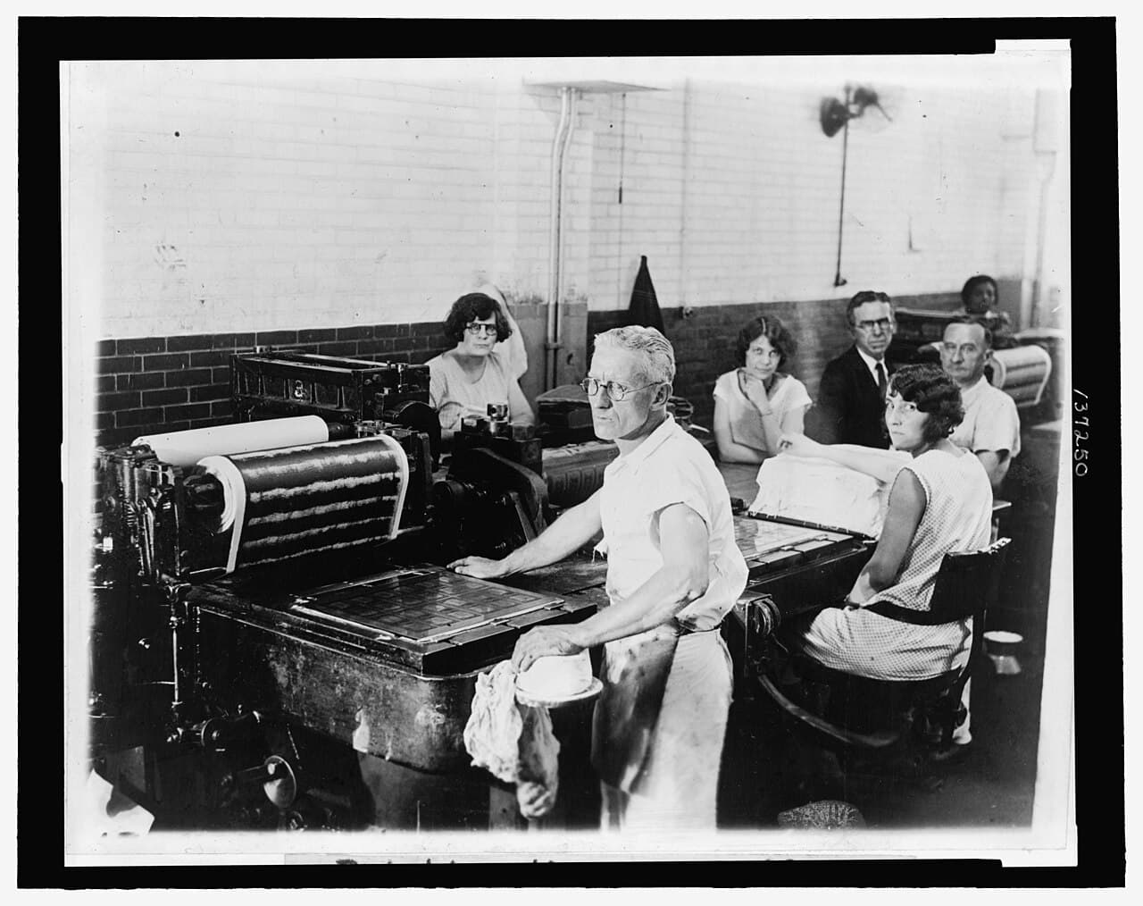 Press operators printing the first small-size U.S. currency at the Bureau of Engraving and Printing, 1929.