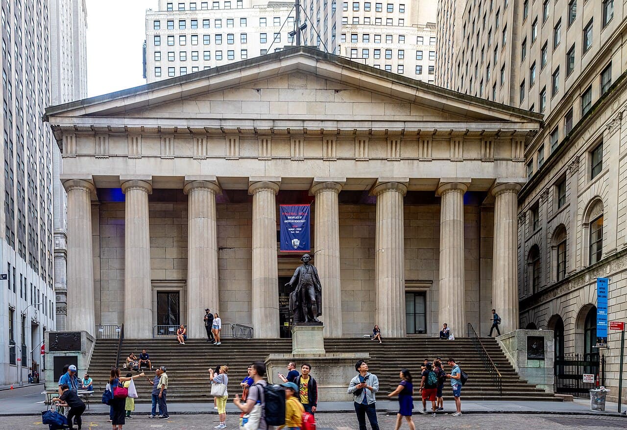 Federal Hall National Memorial on Wall Street in Lower Manhattan, with the statue of George Washington on its steps.