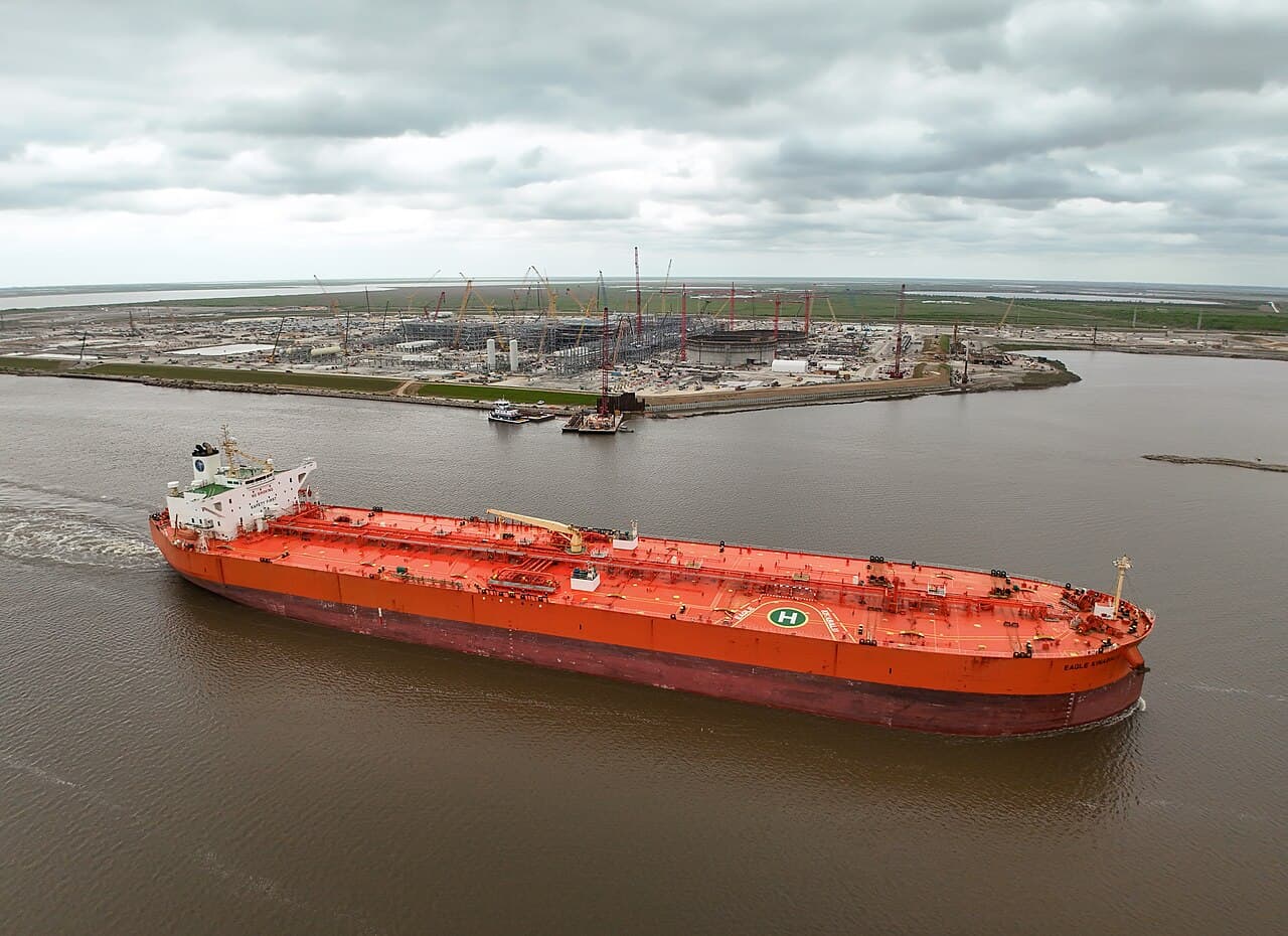 The crude oil tanker Eagle Kinabalu passing an LNG terminal construction site at Port Arthur, Texas.