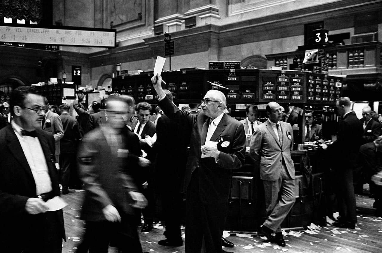 Traders beneath the quotation boards on the floor of the New York Stock Exchange, 1963.
